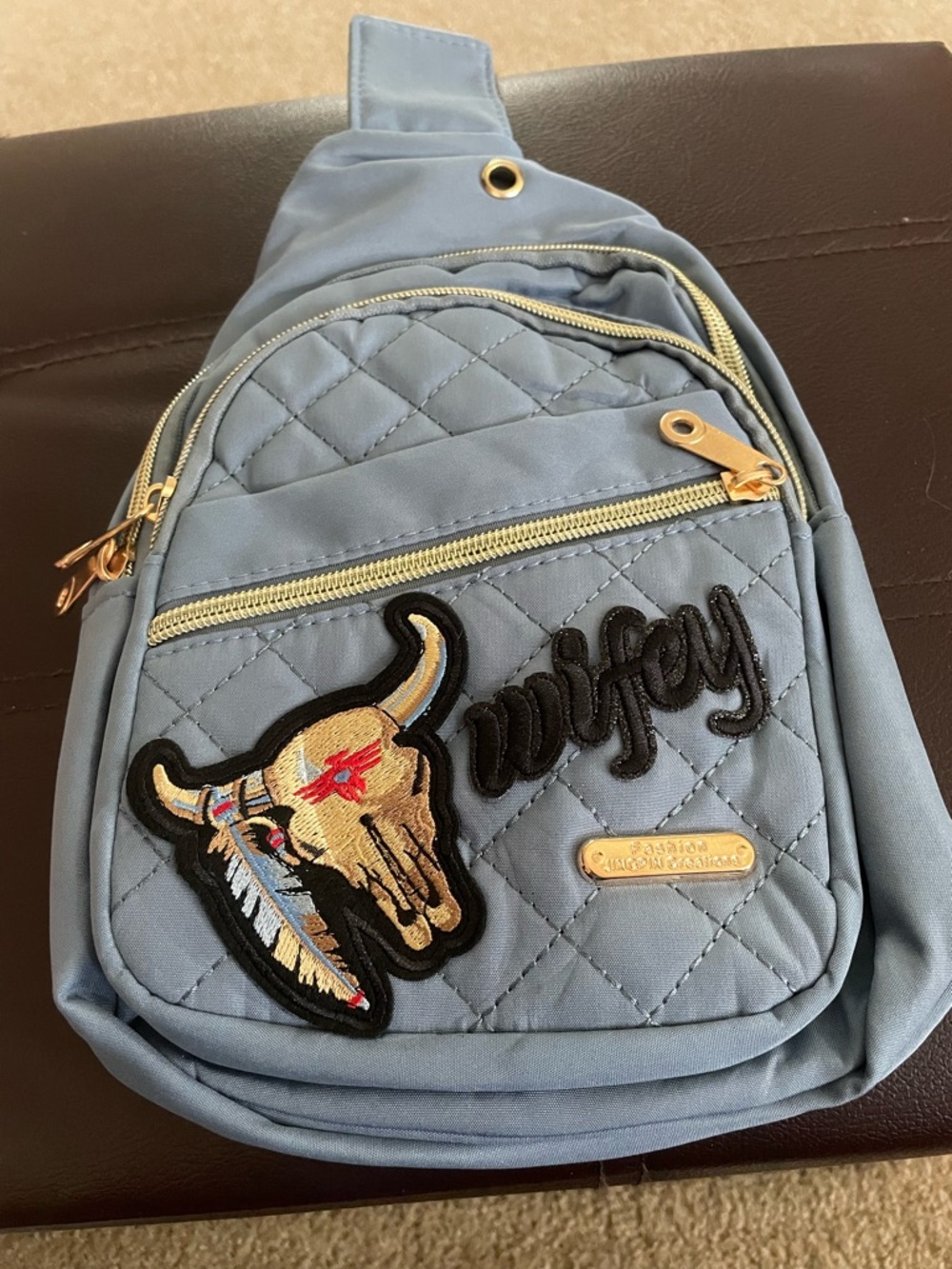 Light Blue Quilted Sling Backpack with Embroidered Bull Patch and Wifey patch